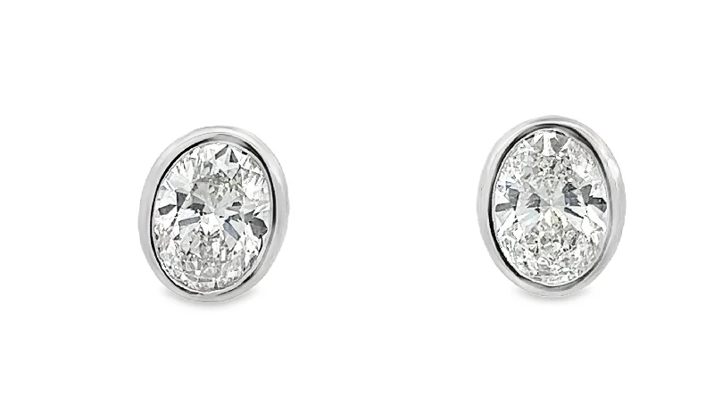 Halo diamond engagement ring in 18K white gold with a center oval - cut stoneLAB GROWN OVAL DIAMONDS 2CTW STUD EARRINGS