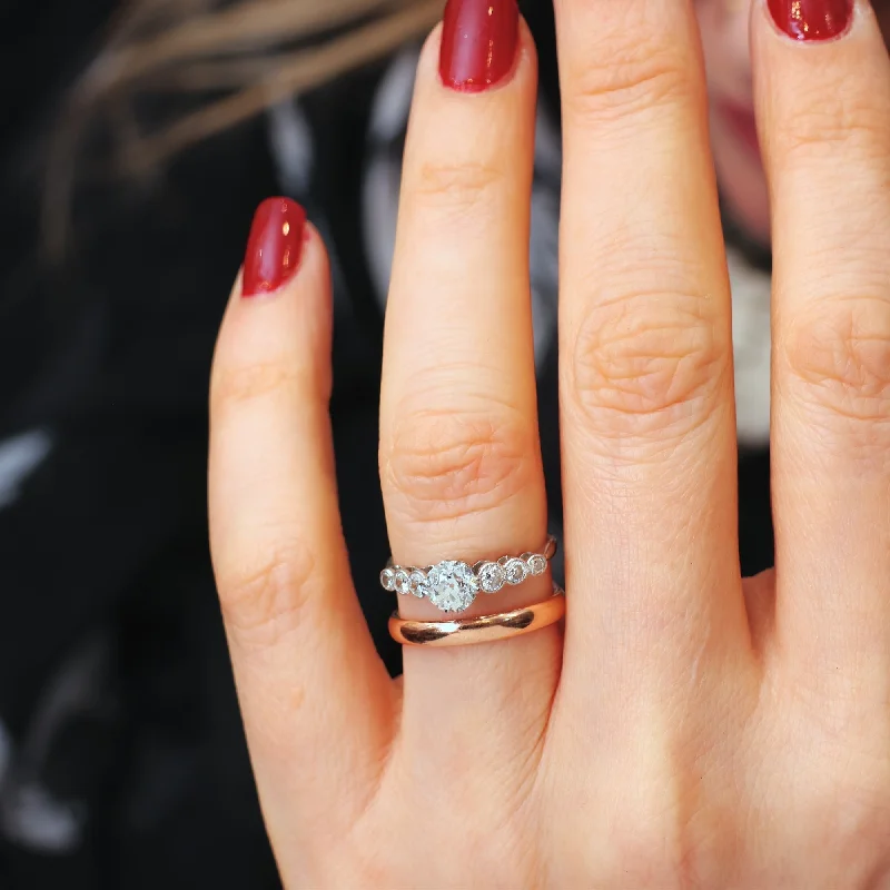 Tennis - Style Women's Rings with a Row of Round Diamonds in PlatinumVintage Rose Gold Wedding Band