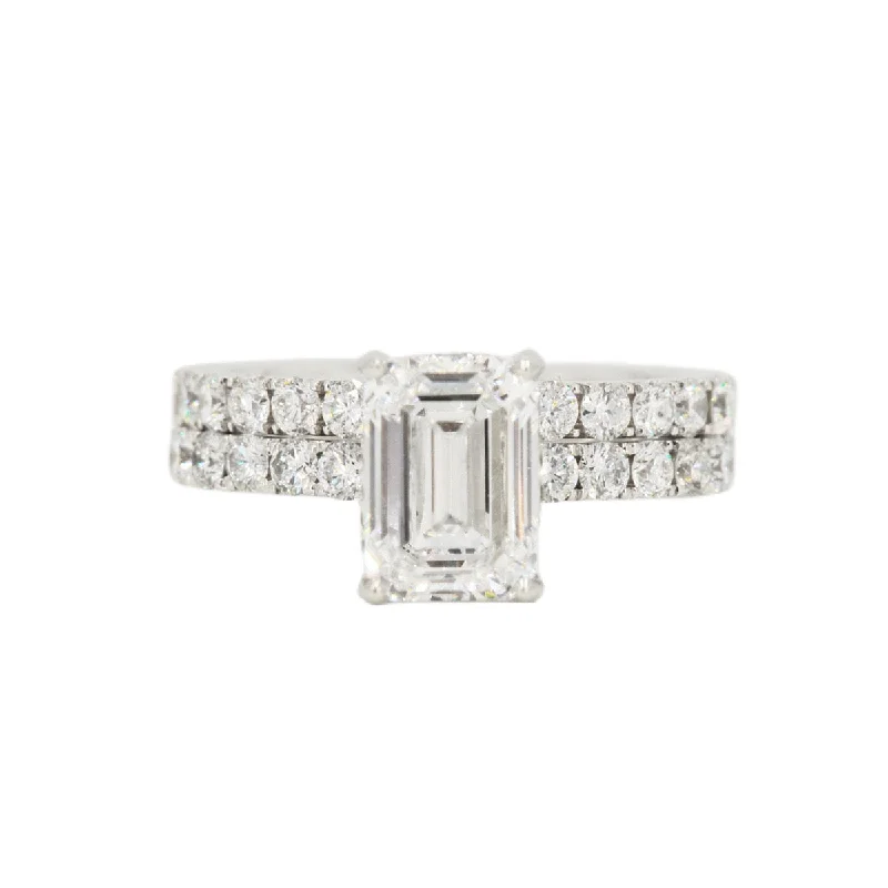 Halo - Style Women's Diamond Rings with a Center Diamond Surrounded by Smaller Diamonds in 18K GoldCustom 2 Carat VVS Emerald Cut Engagement Ring and Wedding Band 18k Gold Set