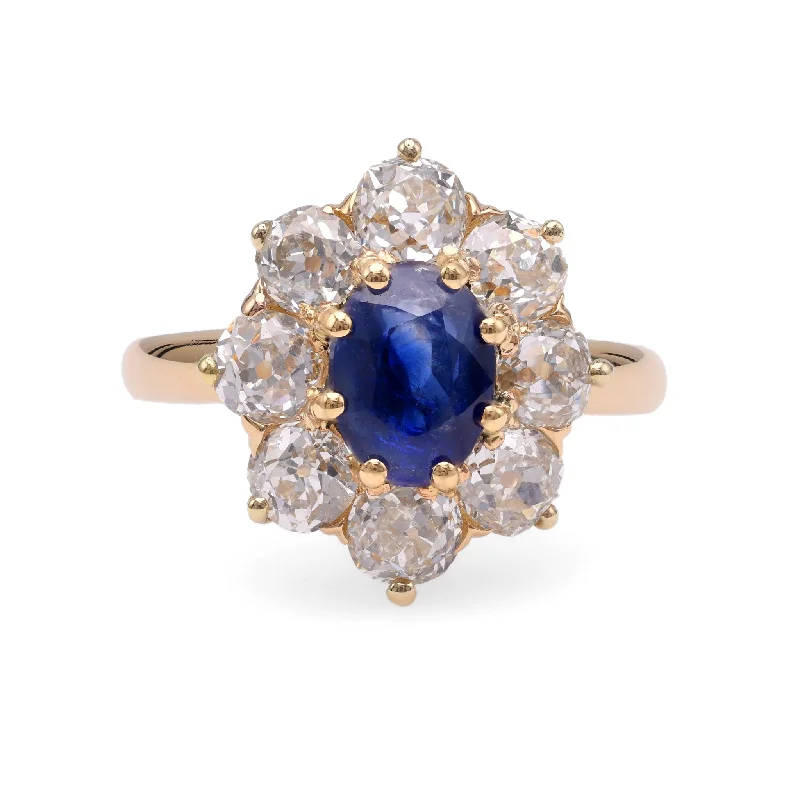 Radiant - cut diamond engagement ring with a bezel - set center stone in 18K yellow goldEdwardian GIA 1.41 Carats Kashmir No Heat Sapphire Diamond 18k Gold Cluster Ring