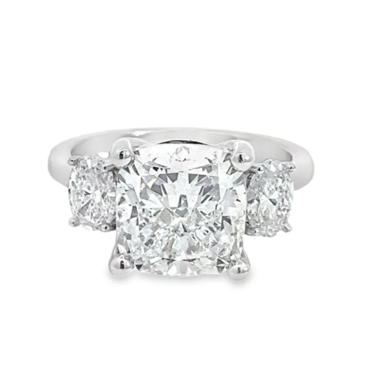 Cushion - cut diamond engagement ring with a halo of moissanite in a silver - plated bandLAB GROWN CUSHION & ROUND DIAMONDS 4.70ctw THREE STONE RING