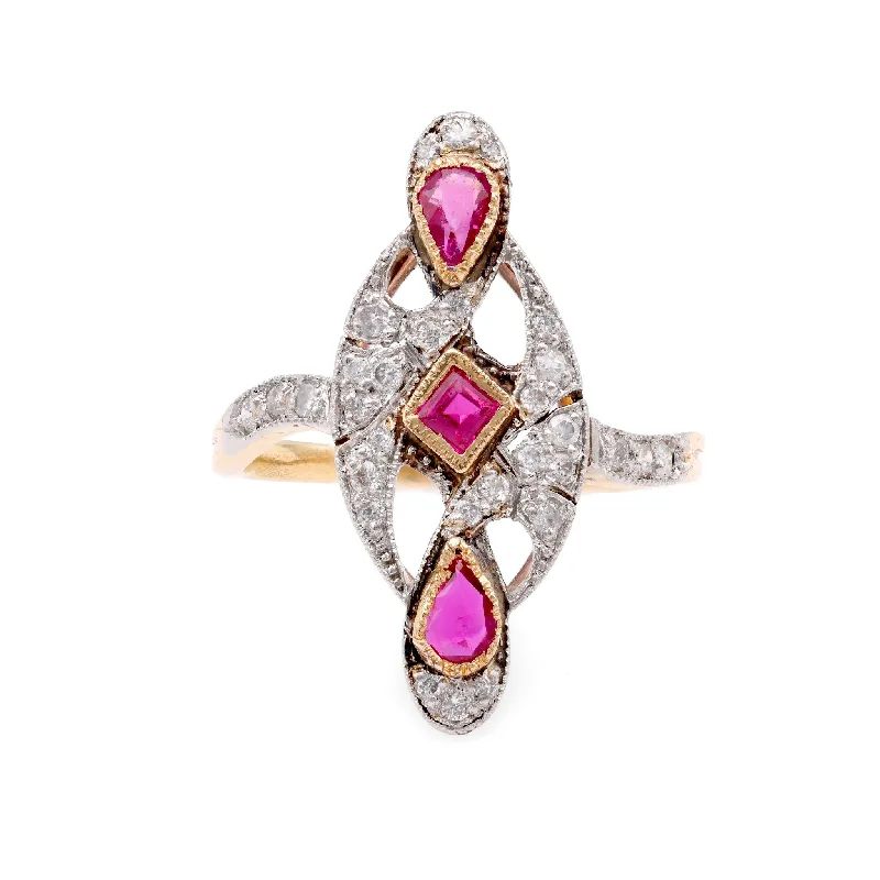 Three - stone diamond engagement ring in rose gold, symbolizing past, present, and futureFrench Ruby Diamond Two Tone Navette Ring