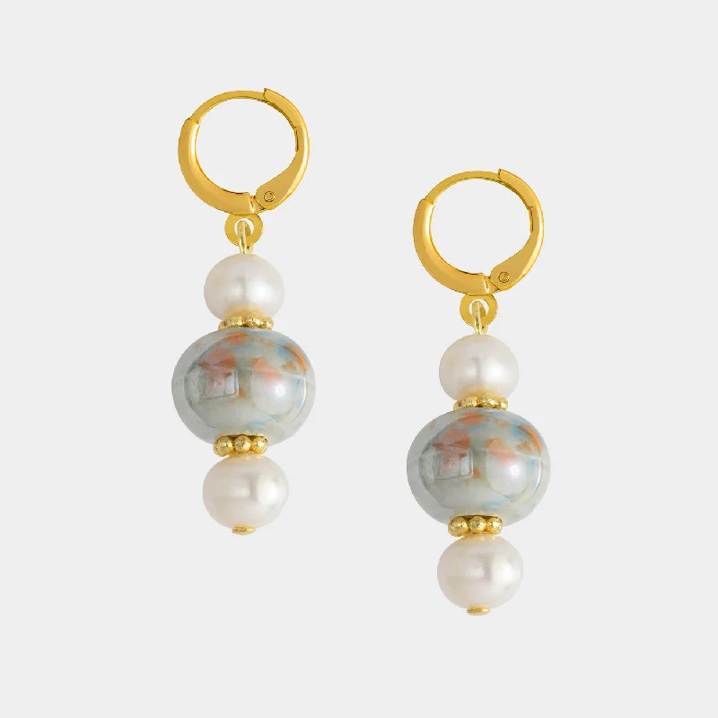 Victorian - era drop earrings with intricate detailsGaida Earrings