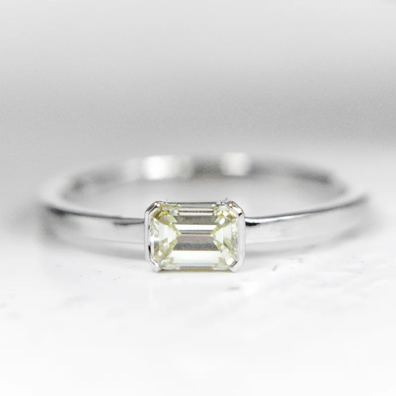 Cluster Engagement Rings with Multiple Small Diamonds Arranged in a Stunning DesignEast-West Emerald cut Diamond ring in 14k White Gold