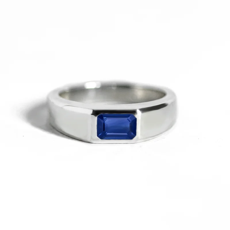 Cathedral - Style Engagement Rings with a Raised Center Stone and Intricate MetalworkEmerald-Cut Sapphire Signet Ring