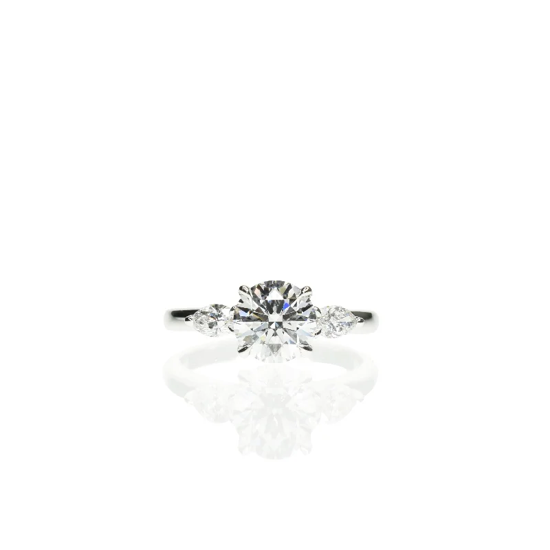 Three - Stone Engagement Rings Symbolizing Love's Past, Present, and Future with Asscher - Cut DiamondsClassic Round Diamond Engagement ring with Marquise Side Diamonds